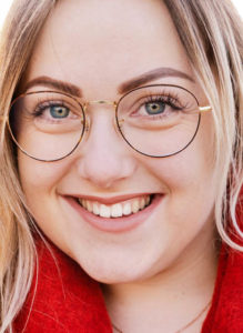 Woman wearing rounded glasses at Eye Roc Eyewear