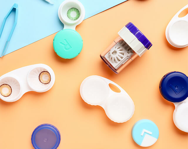 Display of a variety of contact lenses and contact lens cases.