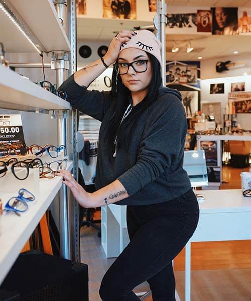 Woman wearing fashionable glasses at Eye Roc Eyewear in St. Louis.