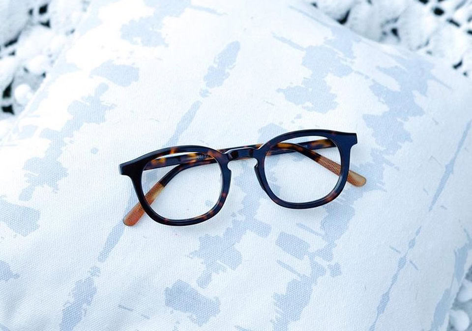 Eyeglasses made of metal melting into sidewalk